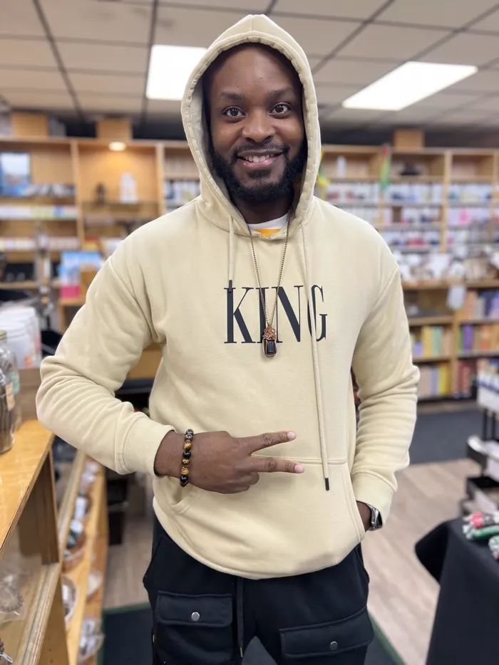 Customer wearing a King hoodie at Nicholas Brooklyn